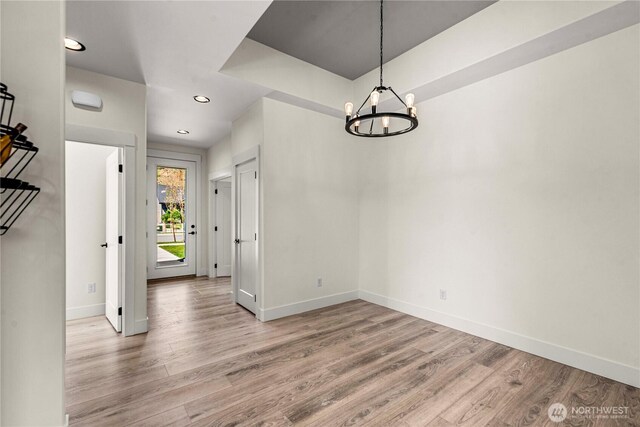 1007 Racine Springs Dr, Wenatchee, WA 98801 - unfurnished dining area featuring light wood finished floors, a chandelier, baseboards, and recessed lighting