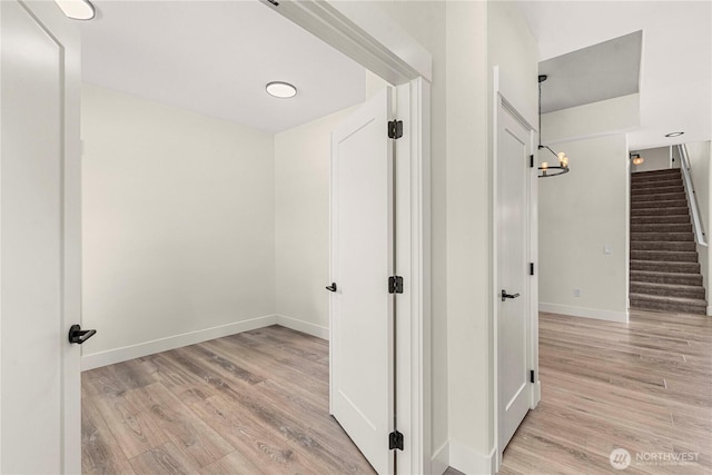 1007 Racine Springs Dr, Wenatchee, WA 98801 - hall with light wood-style floors, stairway, and baseboards