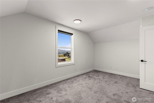 1007 Racine Springs Dr, Wenatchee, WA 98801 - additional living space with vaulted ceiling, carpet floors, and baseboards