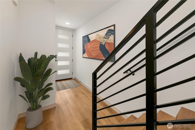 4306 S Holden St, Seattle, WA 98118 - foyer entrance featuring stairway, baseboards, light wood finished floors, and recessed lighting