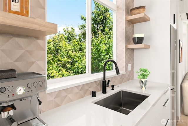 4306 S Holden St, Seattle, WA 98118 - kitchen with a sink, open shelves, decorative backsplash, light countertops, and white cabinetry