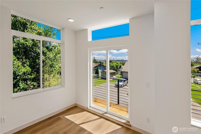 4306 S Holden St, Seattle, WA 98118 - doorway to outside with wood finished floors and baseboards