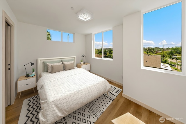 4306 S Holden St, Seattle, WA 98118 - bedroom with wood finished floors and baseboards