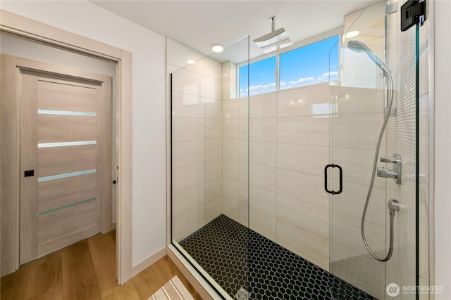 4306 S Holden St, Seattle, WA 98118 - full bathroom with wood finished floors and a stall shower