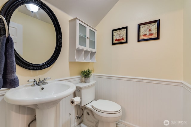 4844 NW Walgren Dr, Silverdale, WA 98383 - bathroom featuring wainscoting, toilet, and lofted ceiling