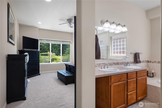 4972 Spokane St NE, Lacey, WA 98516 - bathroom with ceiling fan, double vanity, a tub, and recessed lighting