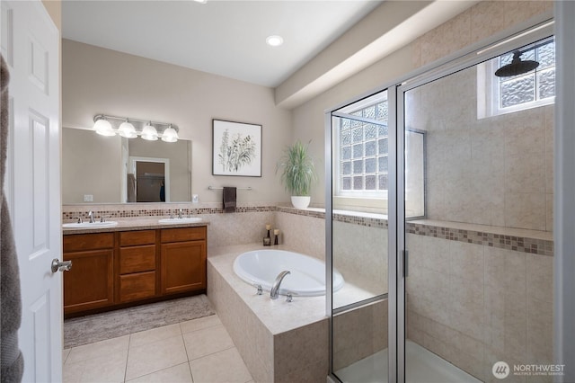 4972 Spokane St NE, Lacey, WA 98516 - full bath with plenty of natural light, double vanity, a bath, and tile patterned flooring