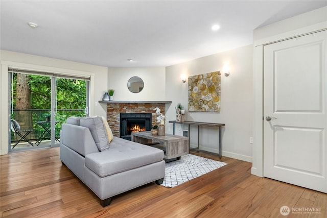 15155 NE 82nd St Unit 103, Redmond, WA 98052 - living area with hardwood / wood-style flooring, a brick fireplace, baseboards, and recessed lighting