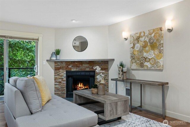 15155 NE 82nd St Unit 103, Redmond, WA 98052 - living area featuring baseboards, wood finished floors, and a fireplace