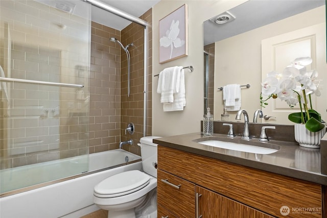 15155 NE 82nd St Unit 103, Redmond, WA 98052 - bathroom with toilet, vanity, and bath / shower combo with glass door