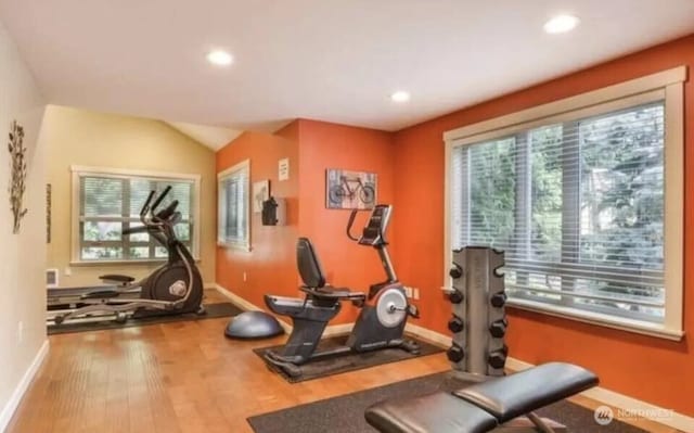 15155 NE 82nd St Unit 103, Redmond, WA 98052 - workout area with healthy amount of natural light, wood finished floors, baseboards, recessed lighting, and lofted ceiling