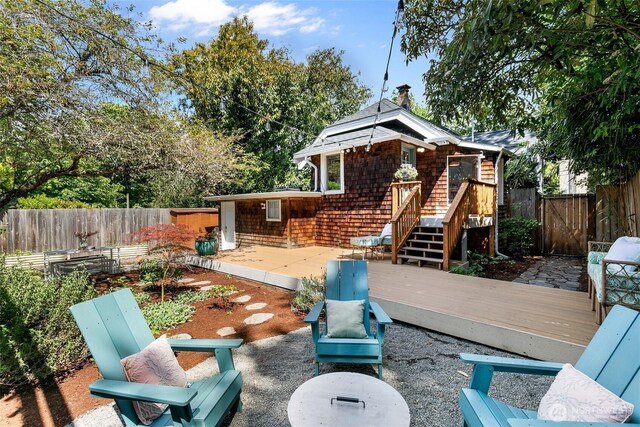7141 47th Ave SW, Seattle, WA 98136 - fenced backyard featuring a wooden deck