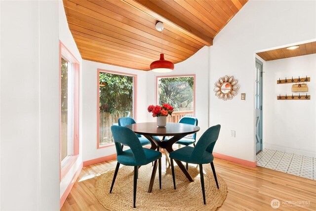 7141 47th Ave SW, Seattle, WA 98136 - dining area featuring wooden ceiling, lofted ceiling, light wood-style flooring, and baseboards