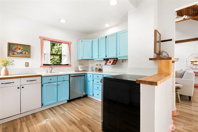 7141 47th Ave SW, Seattle, WA 98136 - kitchen with dishwasher, blue cabinetry, light wood-type flooring, a sink, and recessed lighting