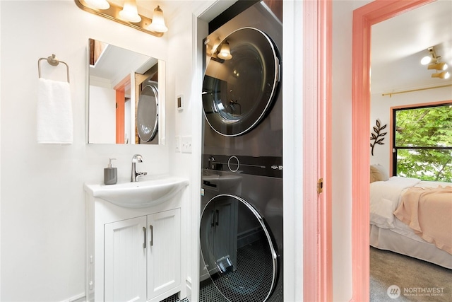 7141 47th Ave SW, Seattle, WA 98136 - laundry room featuring stacked washer / drying machine