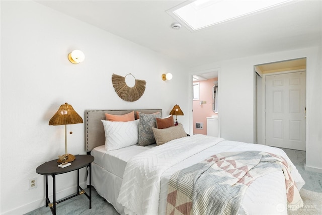 7141 47th Ave SW, Seattle, WA 98136 - carpeted bedroom featuring a skylight, baseboards, and ensuite bath