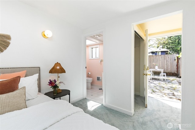 7141 47th Ave SW, Seattle, WA 98136 - carpeted bedroom with baseboards and ensuite bath