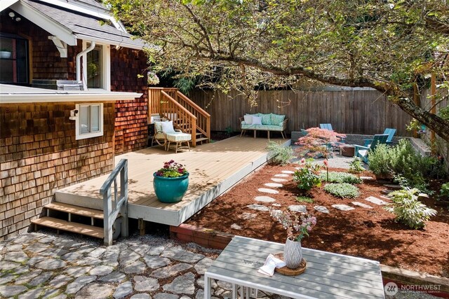 7141 47th Ave SW, Seattle, WA 98136 - wooden terrace with a fenced backyard, a patio, and an outdoor fire pit
