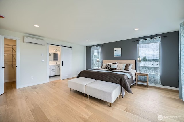 5930 18th Ave S, Seattle, WA 98108 - bedroom with an AC wall unit, multiple windows, a barn door, light wood-style floors, and recessed lighting