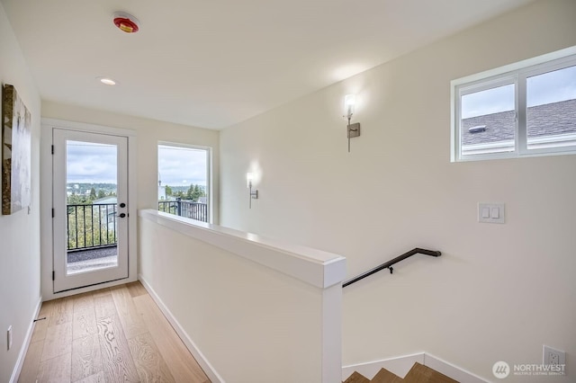 5930 18th Ave S, Seattle, WA 98108 - hallway with an upstairs landing, light wood-type flooring, baseboards, and recessed lighting