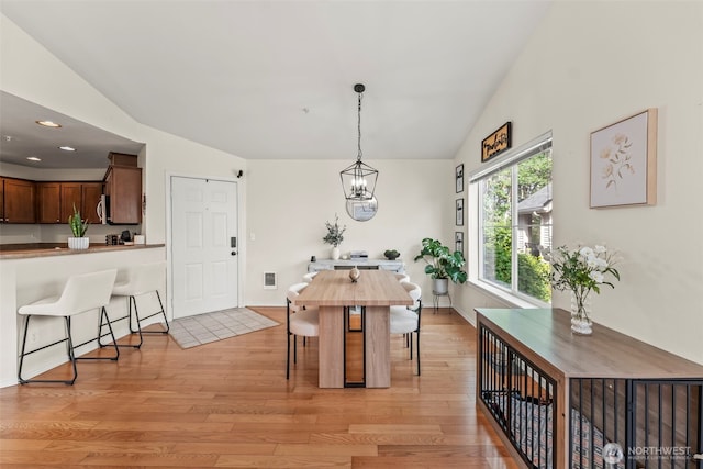 2143 Hammond Ave Unit E10, Dupont, WA 98327 - dining room featuring light wood-type flooring, a chandelier, recessed lighting, and lofted ceiling
