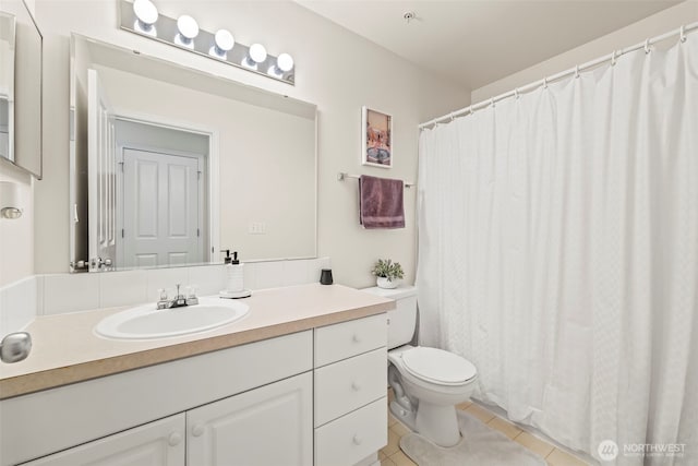 2143 Hammond Ave Unit E10, Dupont, WA 98327 - full bathroom with vanity, toilet, tile patterned flooring, and a shower with shower curtain