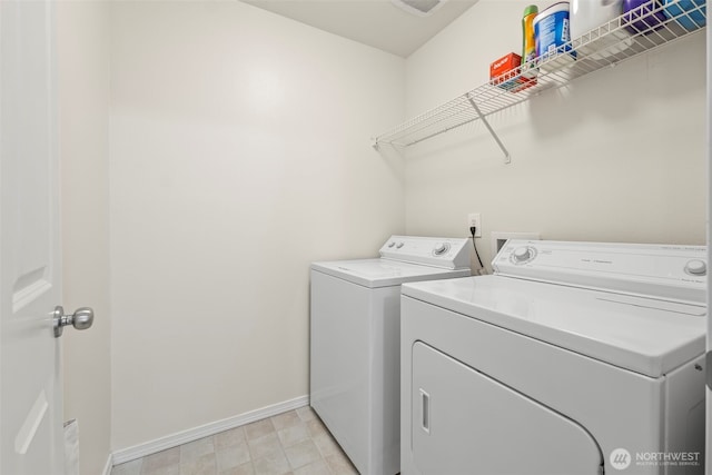2143 Hammond Ave Unit E10, Dupont, WA 98327 - laundry area featuring washing machine and clothes dryer and baseboards