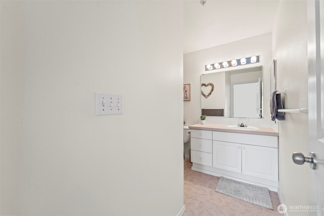 2143 Hammond Ave Unit E10, Dupont, WA 98327 - bathroom featuring vanity, toilet, and baseboards