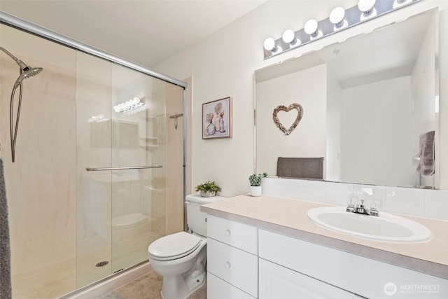 2143 Hammond Ave Unit E10, Dupont, WA 98327 - full bathroom featuring toilet, a stall shower, vanity, and tile patterned floors