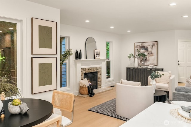16302 NE 104th St, Redmond, WA 98052 - living area featuring wood finished floors, recessed lighting, a stone fireplace, and plenty of natural light