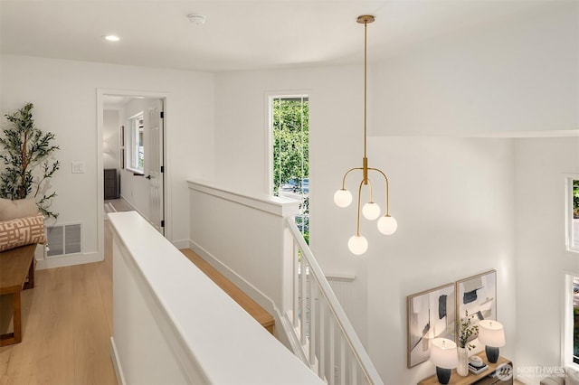 16302 NE 104th St, Redmond, WA 98052 - hallway featuring light wood finished floors, recessed lighting, an upstairs landing, and baseboards