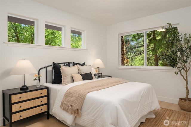 16302 NE 104th St, Redmond, WA 98052 - bedroom featuring baseboards and wood finished floors