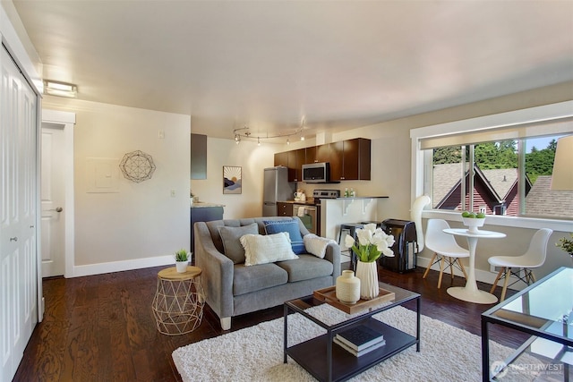 120 NW 39th St Unit 406, Seattle, WA 98107 - living area featuring wood finished floors, rail lighting, and baseboards