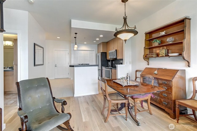 16141 Cleveland St Unit 611, Redmond, WA 98052 - dining room with light wood finished floors and recessed lighting