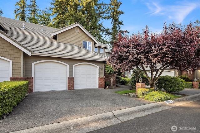15606 Country Club Dr Unit B, Bothell, WA 98012 - view of front of home with brick siding, driveway, and an attached garage