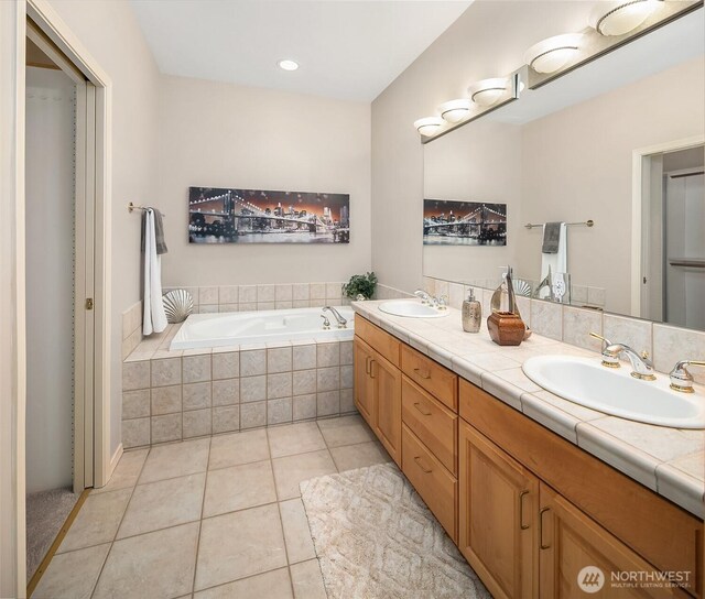 15606 Country Club Dr Unit B, Bothell, WA 98012 - bathroom with double vanity, a bath, tile patterned flooring, and recessed lighting