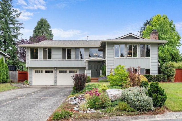 13304 SE 248th Pl, Kent, WA 98042 - raised ranch featuring driveway, a chimney, and a garage