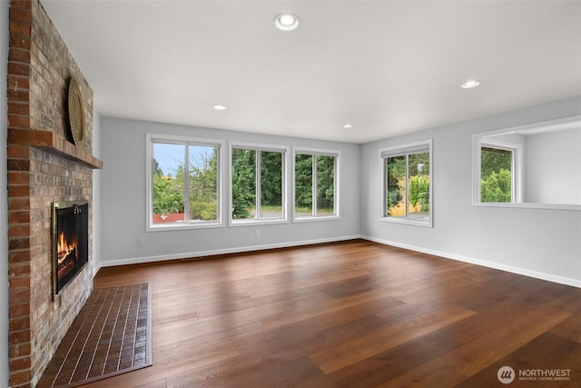 13304 SE 248th Pl, Kent, WA 98042 - unfurnished living room with healthy amount of natural light, a brick fireplace, dark wood finished floors, and recessed lighting