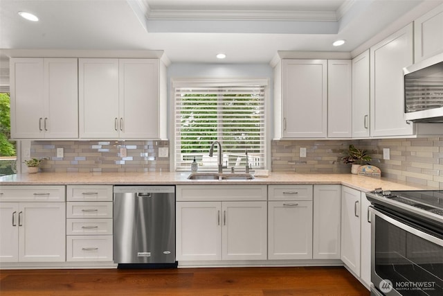 13304 SE 248th Pl, Kent, WA 98042 - kitchen featuring stainless steel appliances, ornamental molding, recessed lighting, white cabinetry, and decorative backsplash