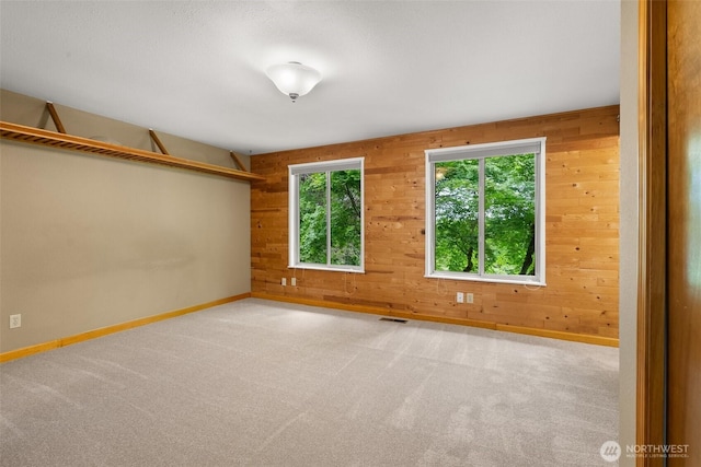 13304 SE 248th Pl, Kent, WA 98042 - carpeted spare room featuring wooden walls and baseboards