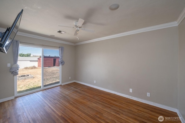 614 E Main Ave, Soap Lake, WA 98851 - spare room with baseboards, wood finished floors, a ceiling fan, and crown molding