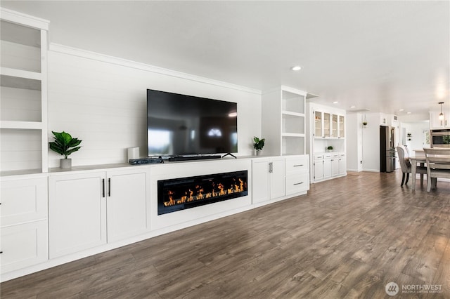 3827 90th Ave E, Edgewood, WA 98371 - living room featuring a glass covered fireplace, dark wood-type flooring, and recessed lighting