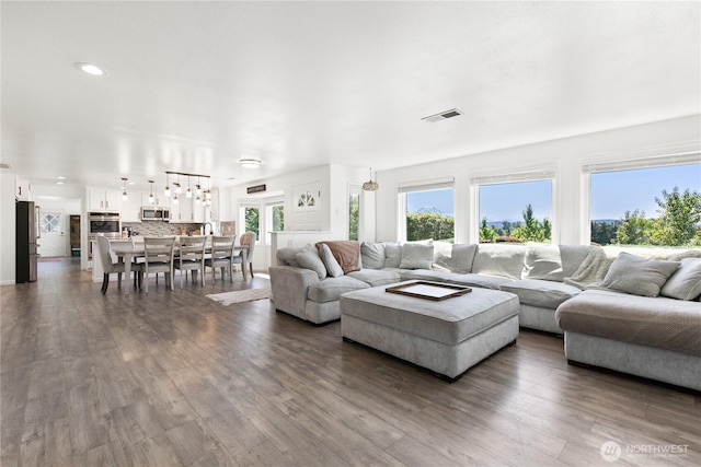 3827 90th Ave E, Edgewood, WA 98371 - living room featuring dark wood-style flooring and recessed lighting