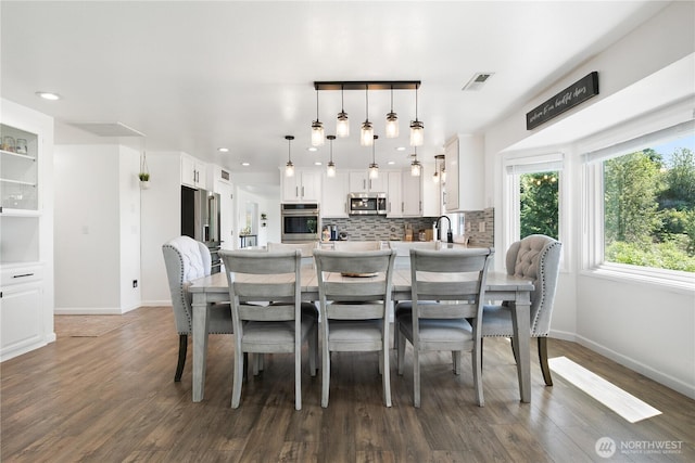 3827 90th Ave E, Edgewood, WA 98371 - dining space with baseboards, wood finished floors, and recessed lighting