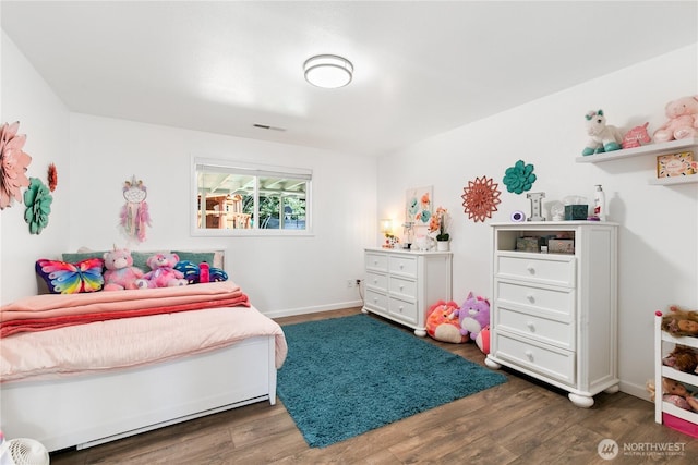 3827 90th Ave E, Edgewood, WA 98371 - bedroom with dark wood-style floors and baseboards