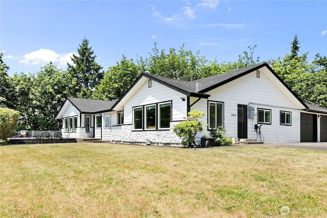 3827 90th Ave E, Edgewood, WA 98371 - view of front of home with a front lawn, a garage, asphalt driveway, and roof with shingles