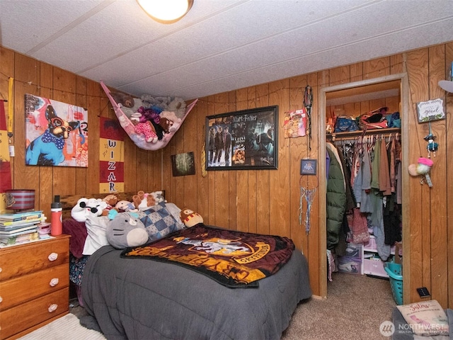 81 Robbins Rd, Sequim, WA 98382 - bedroom with wood walls, carpet, a closet, and a walk in closet