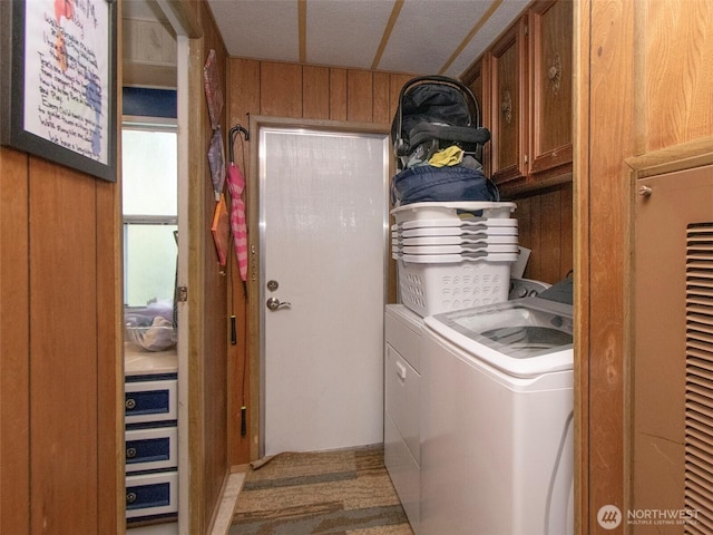 81 Robbins Rd, Sequim, WA 98382 - washroom featuring cabinet space, washer and clothes dryer, wooden walls, and carpet