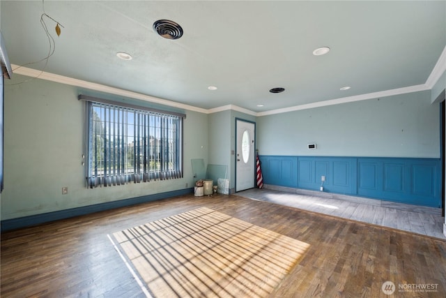 1203 S 8th Ave, Yakima, WA 98902 - unfurnished room featuring wood-type flooring, wainscoting, crown molding, and recessed lighting