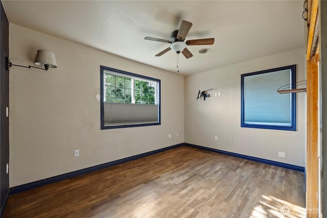 1203 S 8th Ave, Yakima, WA 98902 - unfurnished room with wood finished floors and ceiling fan